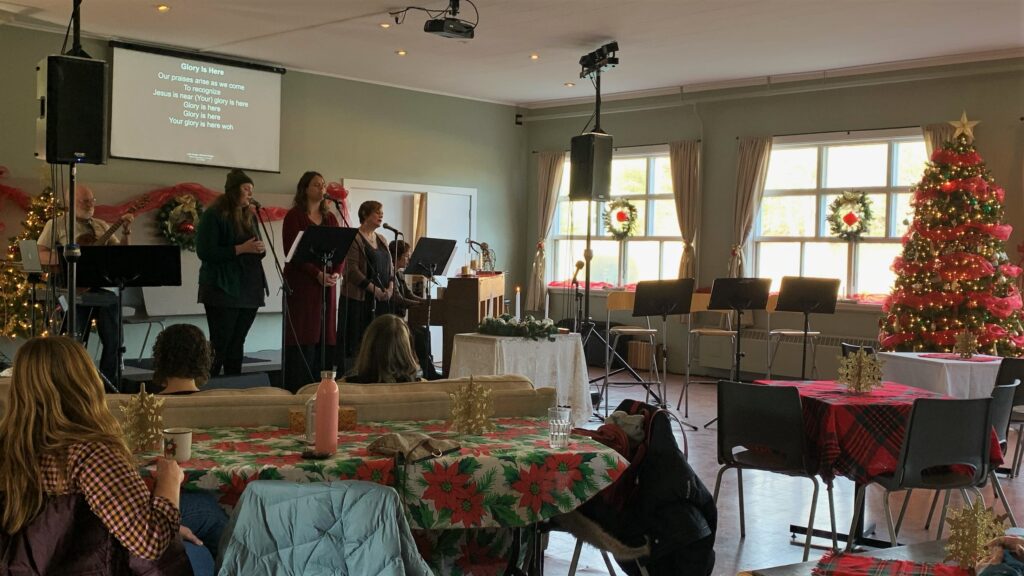 Singers lead at a festively decorated service