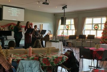 Singers lead at a festively decorated service