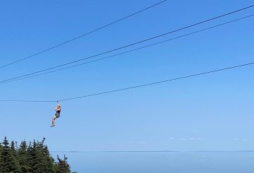 jess clinging to a zipline