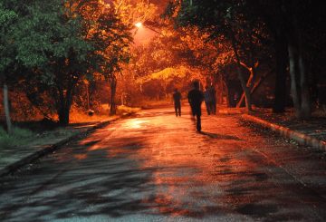 walking down dark street, fading