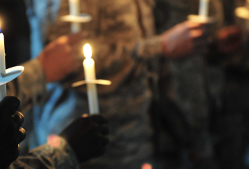 hands holding candles