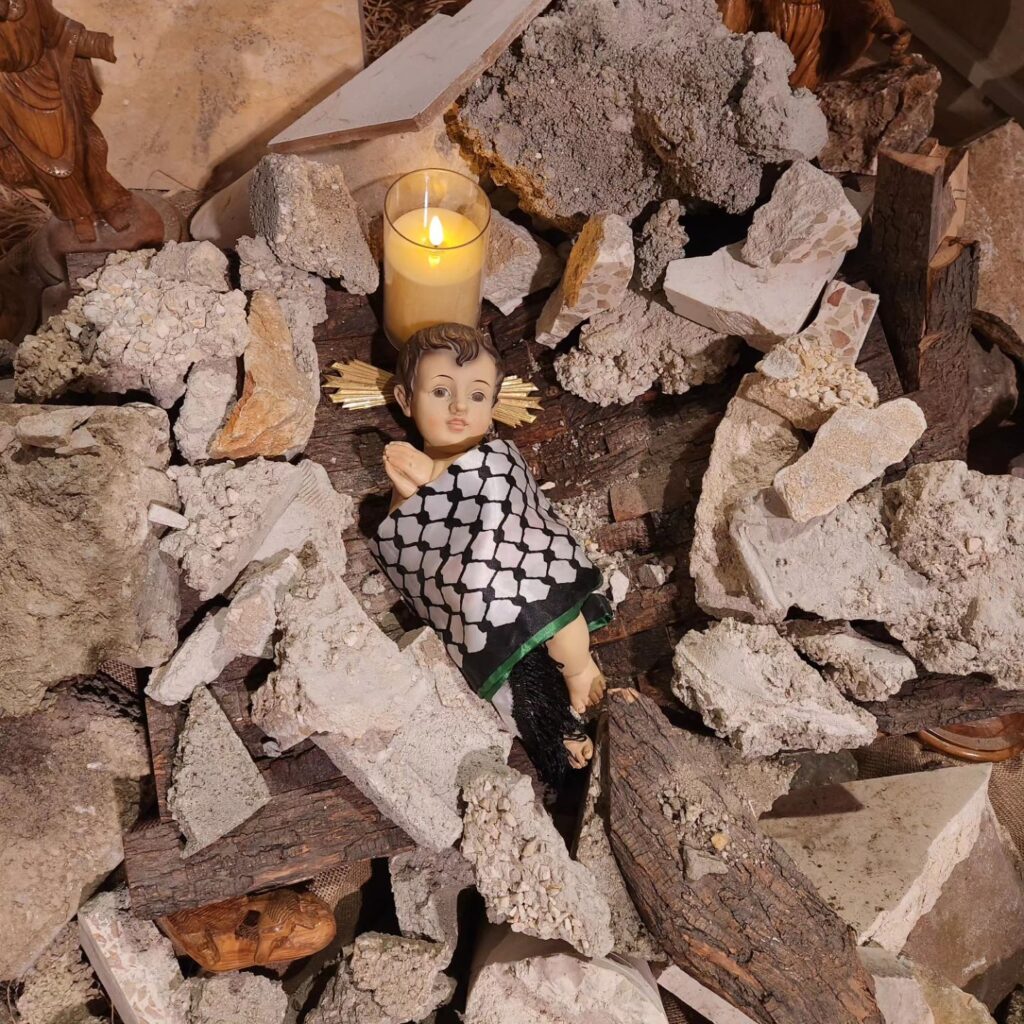 figure of baby Jesus in the rubble