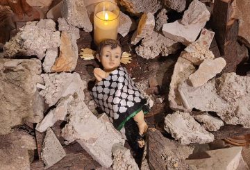 figure of baby Jesus in the rubble