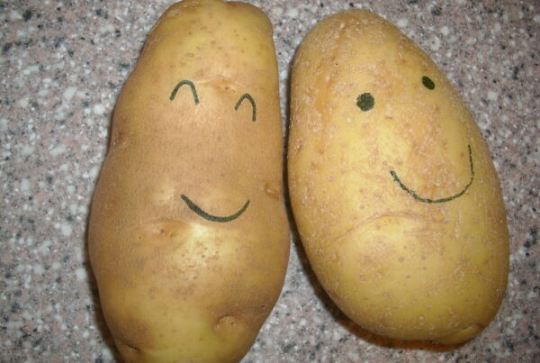 two smiling poatoes
